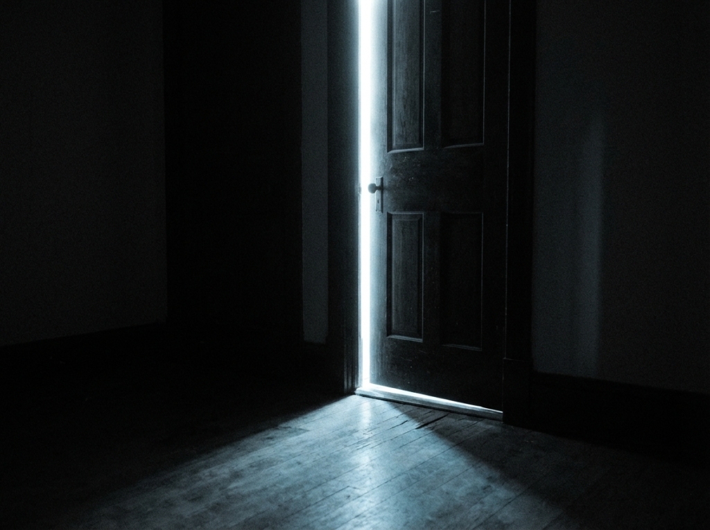 Door pushed ajar in morning sunlight shot from inside — landlord illegal entry criminal trespass BNS India